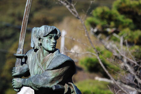 Sculpture of a japanese warrior with a swordの写真素材