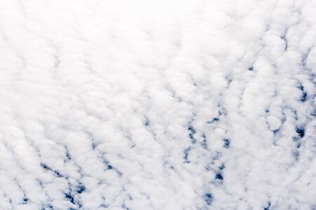 Blue sky with white clouds backgroundの写真素材