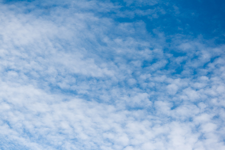 Blue sky with white clouds backgroundの写真素材