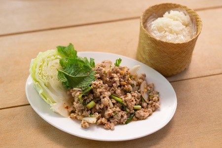 Thai Spicy minced meat salad with sticky riceの写真素材