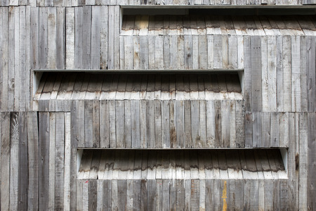 background of the wall of an old house with a window with room for textの写真素材