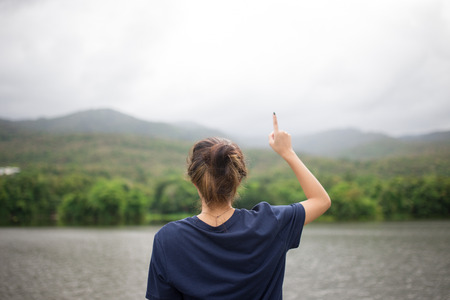 what do you think ,Young girl has an ideaの写真素材