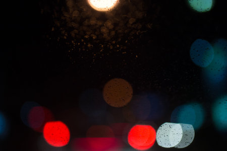 Decorative neon lights in soft focus, raining