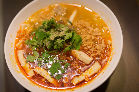 spicy noodle soup in black backgroundの写真素材