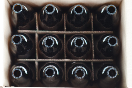 Dozen of empty bottles in a cartonの写真素材