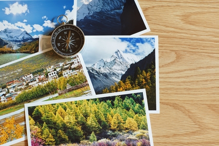 Compass on blur colorful nature photograph of popular tourist destination in autumn background, China traveling conceptの写真素材