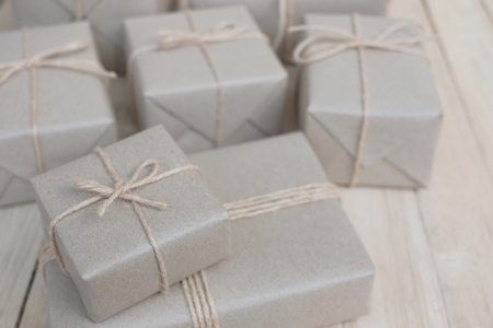 Eco friendly gift boxes wrapped with brown paper, green happy new year present concept, copy spaceの写真素材