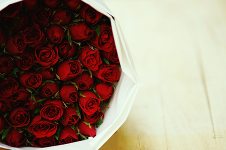 Big bundle of red rose bouquet with bright background light, copy space, sweet valentine conceptの写真素材