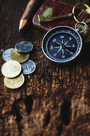 Vintage tone compass, coin, key and map, antique travel concept, copy spaceの写真素材