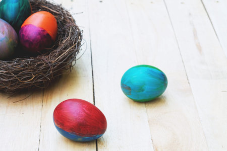 Decorative colorful painting easter eggs in nest, fun event activity for kid concept, copy space