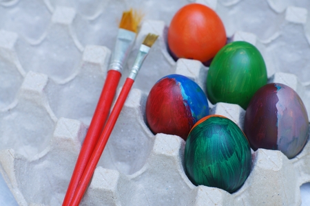 Decorative colorful painting easter eggs in nest, fun event activity for kid concept, copy spaceの写真素材