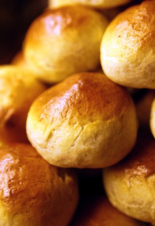 Golden wheat buns freshly baked, straight from the ovenの写真素材