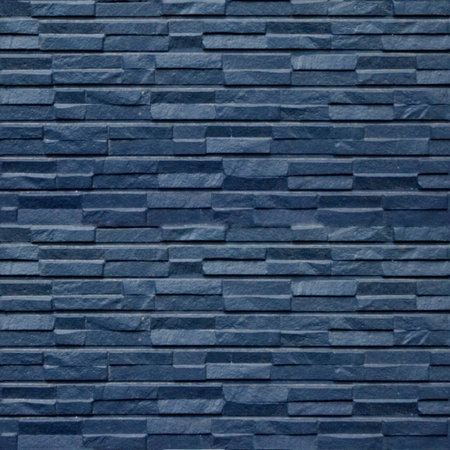 Seamless pattern with blue stone wall panels of the original squared form