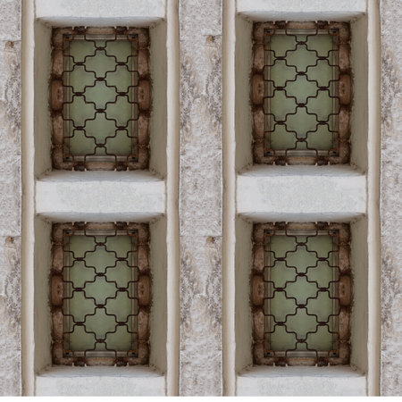 Seamless pattern of ancient castle window with big stone blocks and rust barsの写真素材