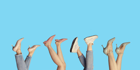 Creative banner of woman's legs showcasing modern summer shoes, isolated on a bright blue background...