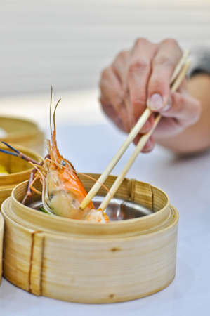 Chinese steamed dimsum in bamboo containers traditional cuisine の写真素材
