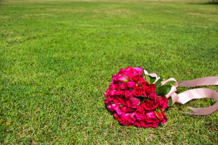 Bouquet of rose on the lawn の写真素材