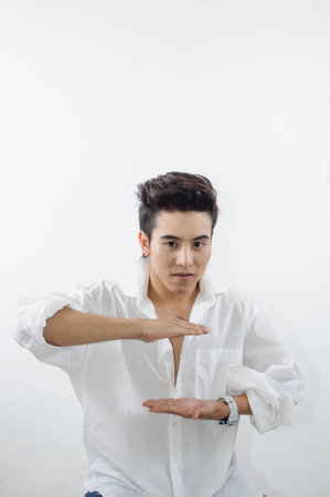 young man showing us somethingの写真素材