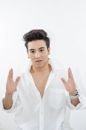 young man showing us somethingの写真素材