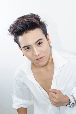 young man showing us somethingの写真素材