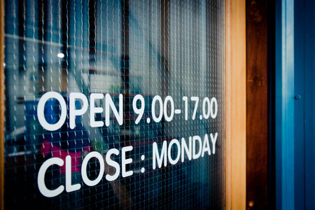 wooden door open sign and blue corrugated metal sheeの写真素材