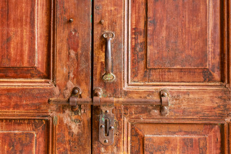 door knob on red old wooden doorの写真素材