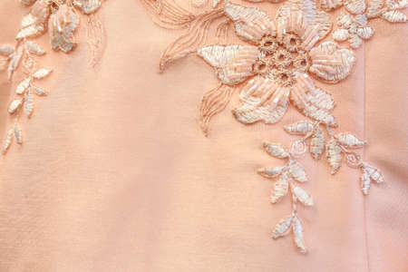 Beautiful lace with flower pattern - macro photo on wedding dress