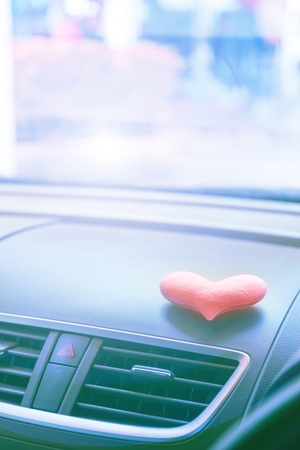Inside the car with Pink heart with light filterの写真素材
