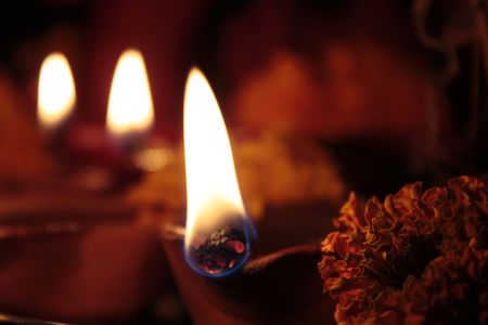 four earthen lamps(diya) on diwali