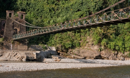 120 yrs old suspension bridge over Kosi river near the  near Garjiya Temple, Ramnagar, Uttarakhand, Indiaのeditorial素材