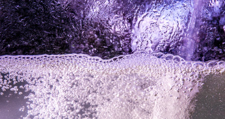 Sparkling bubbles in splashing water.の写真素材