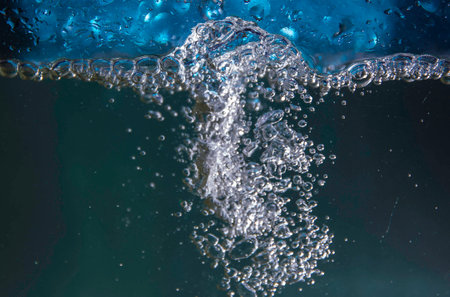 Sparkling bubbles in splashing water.の写真素材