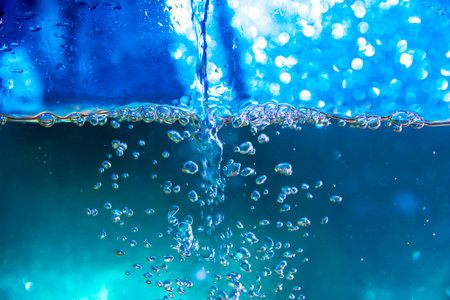 Sparkling bubbles in splashing water.