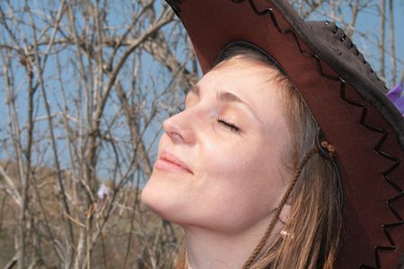 beauty young woman with cowboy hatの写真素材