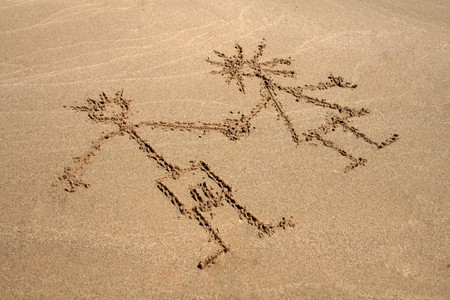 Image of two peaple on the sandの写真素材