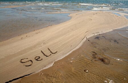 The Text string Sell on the sand