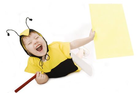 Cute little girl in bumble bee costume.の写真素材