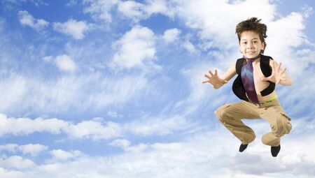 Happy boy Jumping in the skyの写真素材