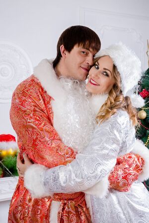 Cheerful family celebrating Christmas. Russian traditions. Father Frost and maiden Snow.の写真素材