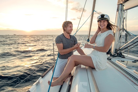 Romantic proposal scene on yachtの写真素材