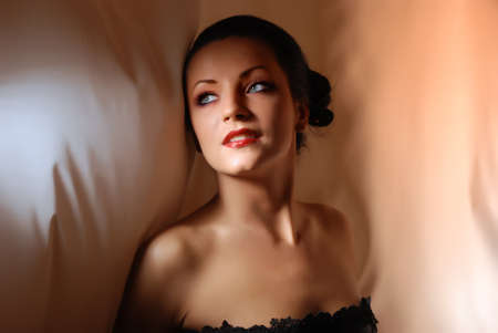 portrait of a girl on the background of the fabric