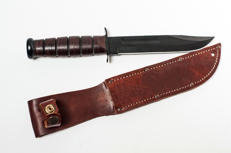 Hunting knife with leather case on white background