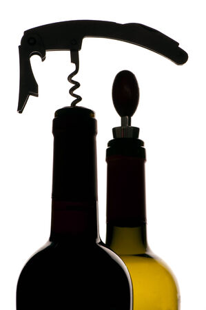 Corkscrew and bottles of wine isolated on a white backgroundの写真素材