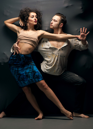 Young couple dancing contemporary. Studio photoの写真素材
