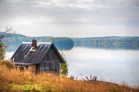 Wooden country house on lake shoreのeditorial素材