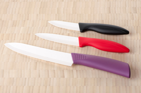Three ceramic knives with color handles closeupの写真素材