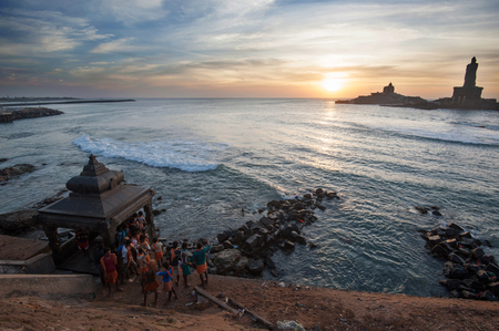 People greet the sunrise in Kanyakumari the southernmost point of the Indian subcontinent, Tamil Nadu, Indiaのeditorial素材