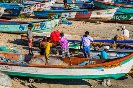 Children help fisherman untangle a network, Kanyakumari, Tamil Nadu, Indiaのeditorial素材