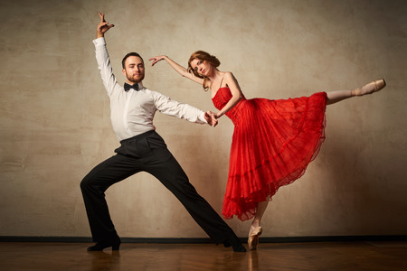 Female ballet dancer and male latin dancer mix the styles together.の写真素材
