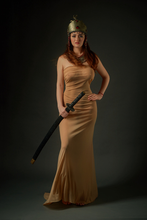 Female in antique bousani jewellery and wedding helmet with swordの写真素材